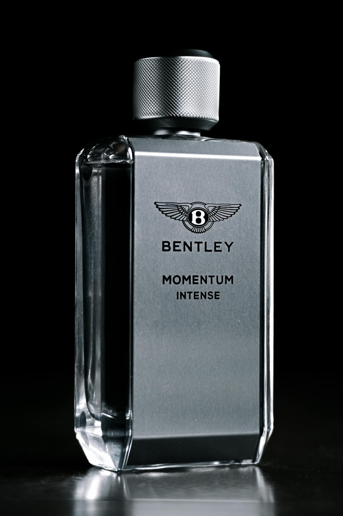 Luxury Bentley Momentum Intense cologne bottle in a sleek design, ideal for fragrance enthusiasts.